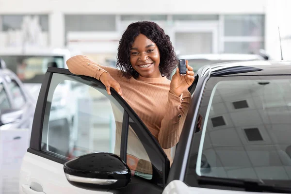 Happy African Woman Holding Keys To New Car And Smiling At Camera