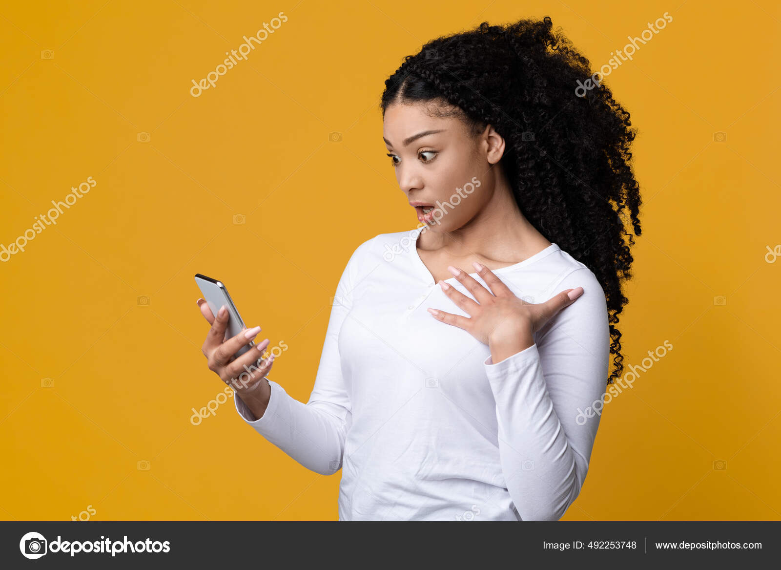 Shock Dazed African American Woman Looking At Smartphone