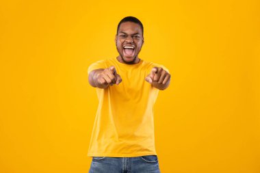 African Man Pointing Fingers With Both Hands At Camera, Studio clipart