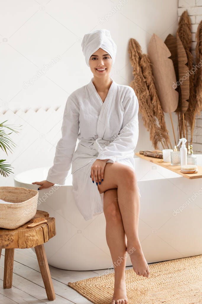 Lady Posing In Bathrobe With Towel On Head In Bathroom