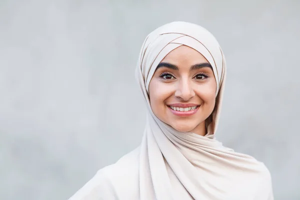 Portrait of cheerful cute atraktive young arabian islamic female in hijab look at camera — Stok Foto