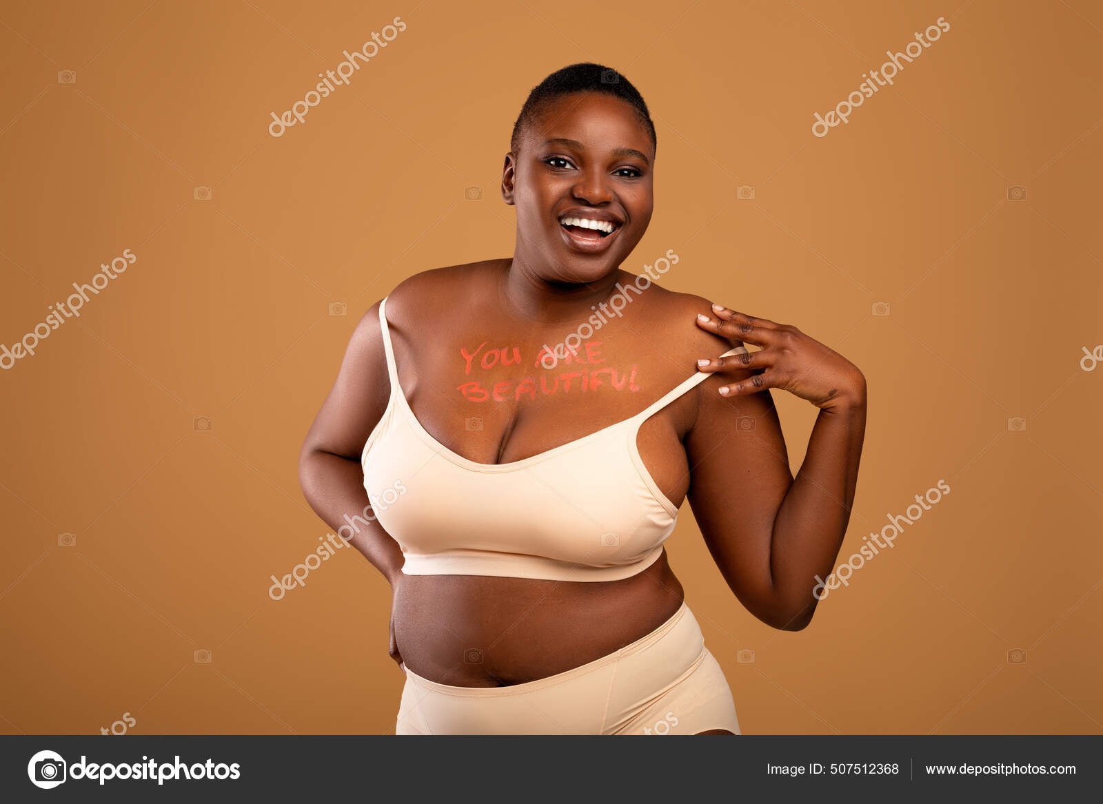 Portrait Of Curvy Smiling Black Woman In Underwear Posing Stock