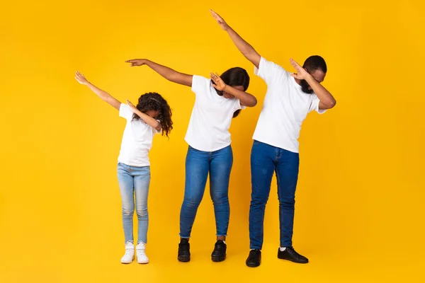 Portrait of black family dancing dabbing at studio — Stock Photo, Image