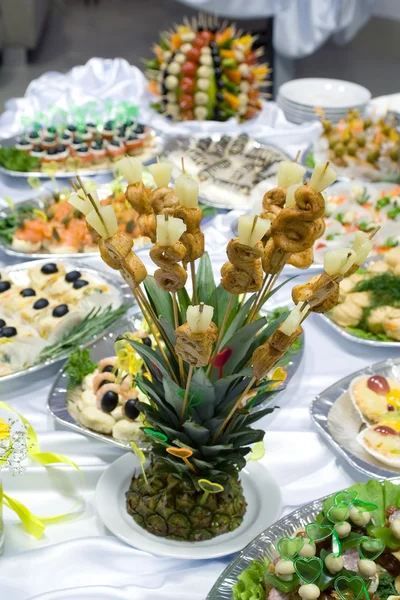 Catering buffet style - pineapple decorated with roasted chicken 