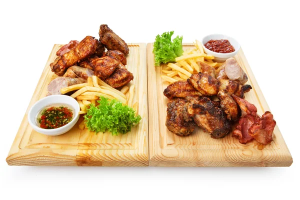 Restaurant food isolated - grilled meat assortment served on woo — Stock Photo, Image
