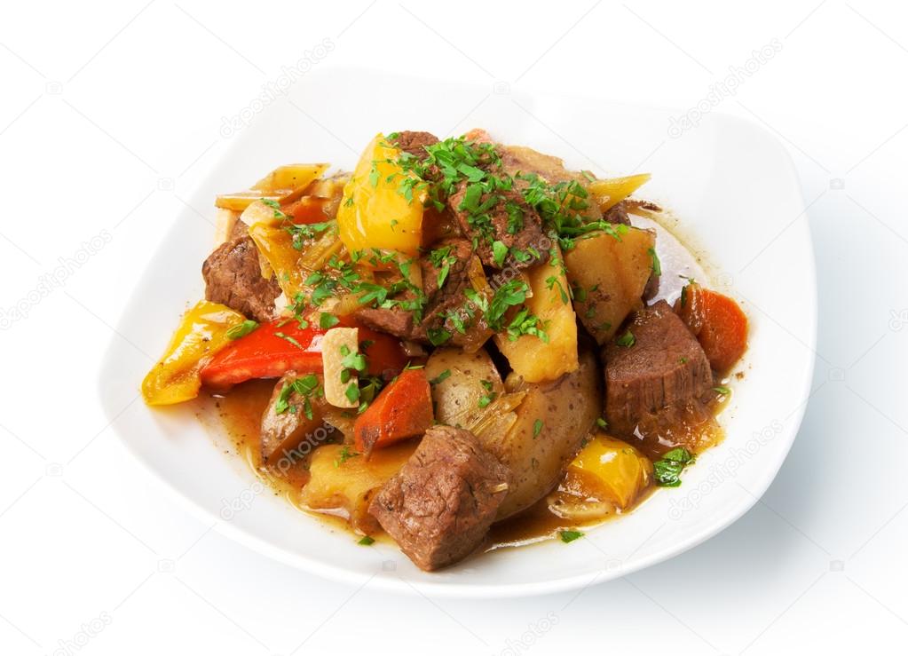 Restaurant food isolated - beef stew with green parsley