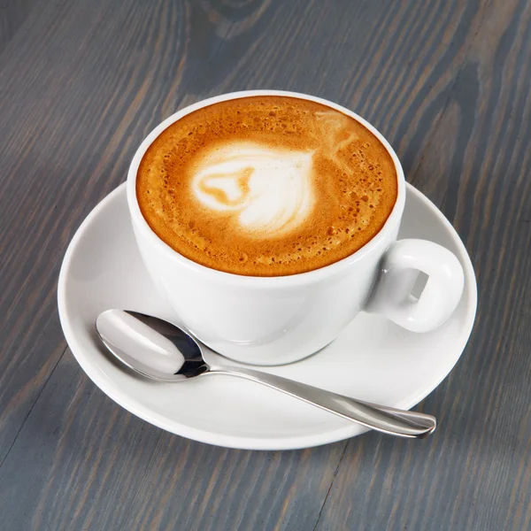 Cup of cappuccino coffee with heart — Stock Photo, Image
