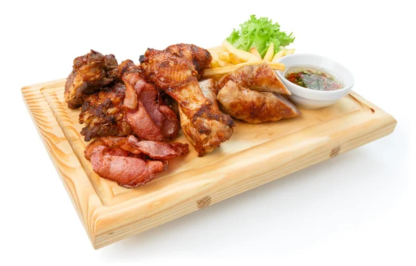 Restaurant food isolated - grilled meat assortment served on woo — Stock Photo, Image