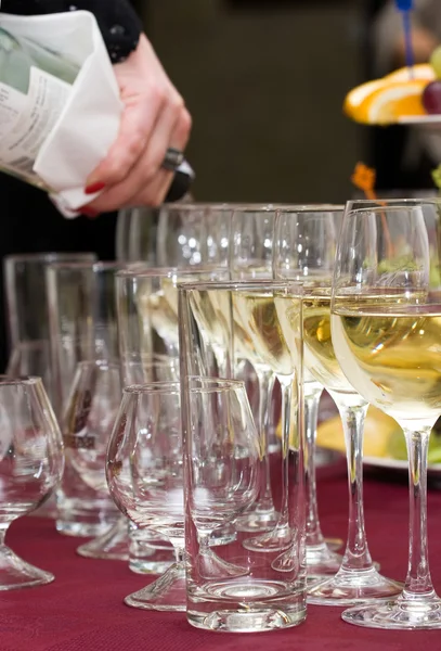 Catering - pouring out the wine — Stock Photo, Image