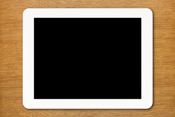 Tableta blanca PC con pantalla negra sobre la mesa — Foto de Stock