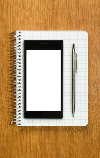 Concepto de negocio y educación: smartphone y bloc de notas — Foto de Stock