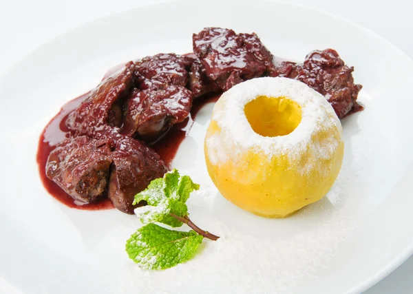Restaurant food isolated - chicken liver in pomegranate sauce
