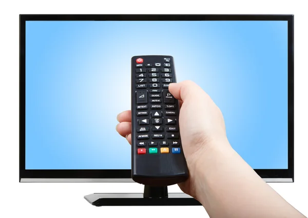 Hand with remote control pointing at modern TV set — Stock Photo, Image