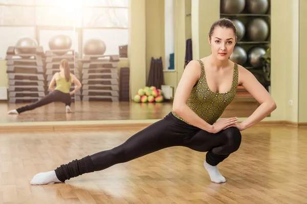 Young Woman Doing Side Split in Fitness Class Stock Photo - Image
