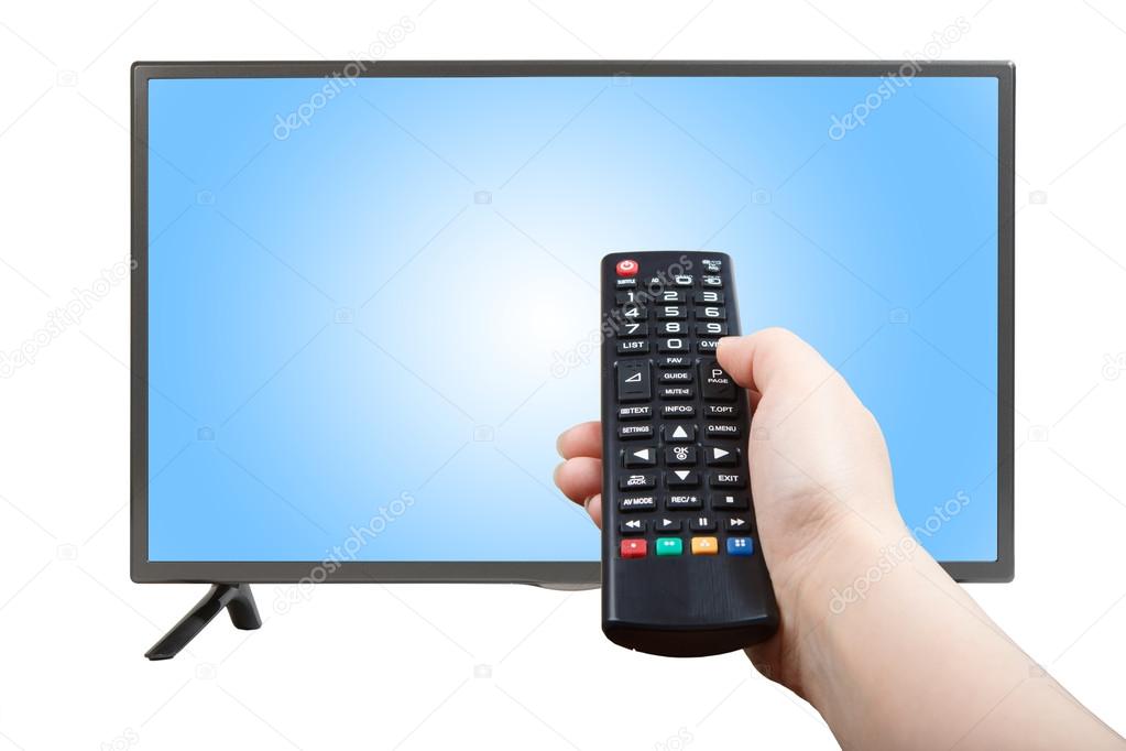 Hand with remote control pointing at modern TV set