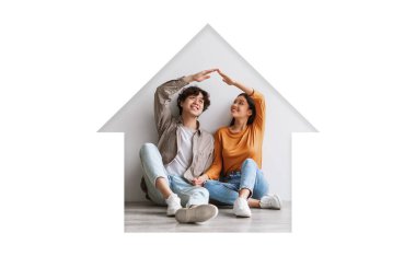 Genç bir çift yerde oturur ve elleriyle bir kalp şekli oluştururlar. Açık renkli bir odada mutlu ve rahat görünüyorlar. Sıcak bir atmosferde birbirlerine eşlik ederek eğleniyorlar..