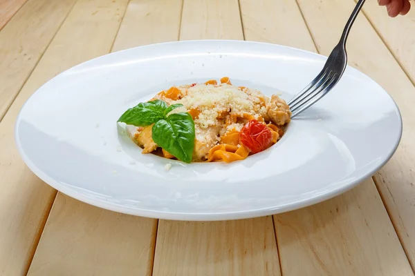 Eating traditional italian pasta  with fork — Stock Fotó