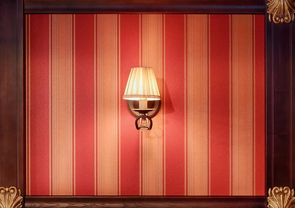 Classic chandelier lamp at the red striped wall — Stock Photo, Image