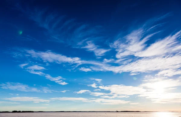 Blue sky under the lake in winter