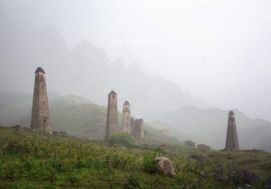 The ancient tower complex of Niy in Ingushetia in the rain clipart