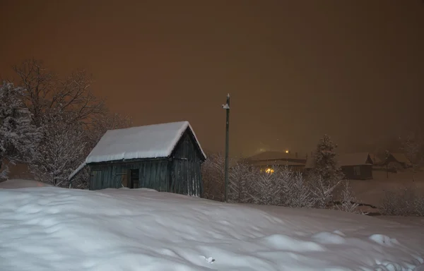 Snowy night in the village — Stock Photo, Image