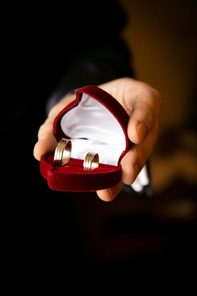 Man holding red heart shaped box — Stock Photo, Image