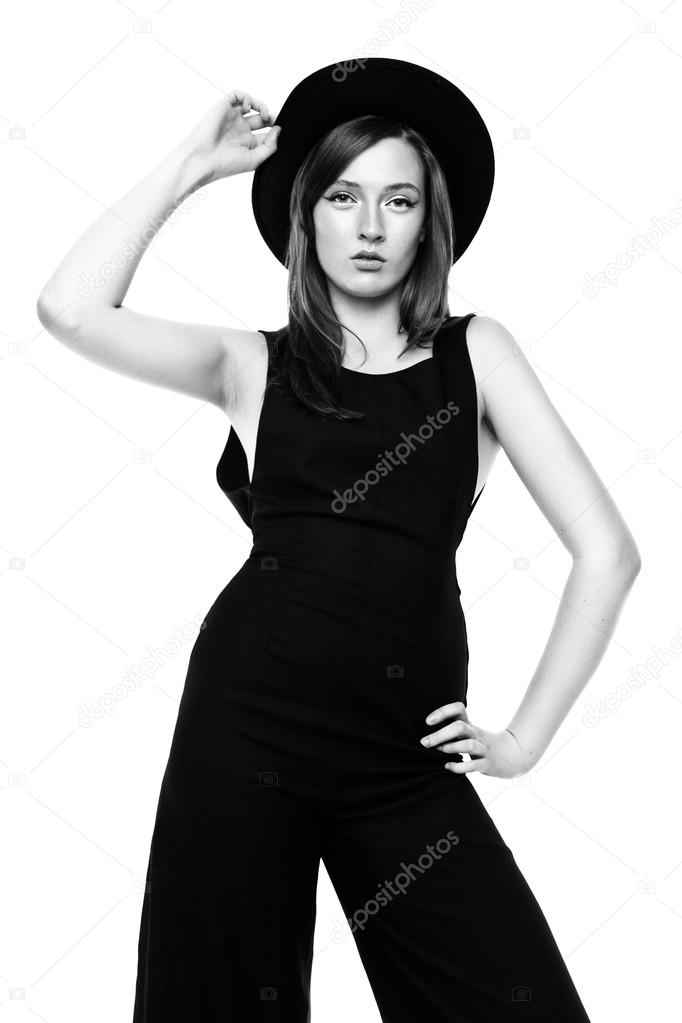woman in black overall and hat