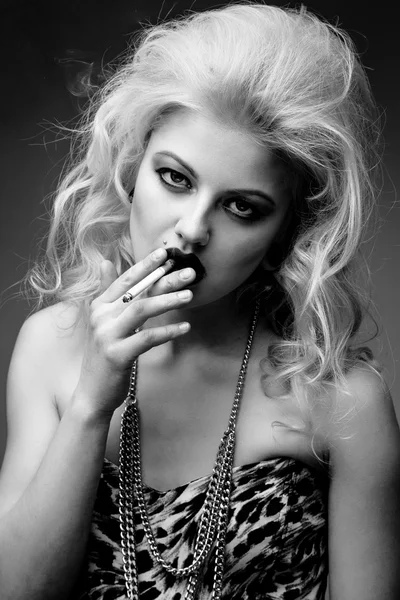 Portrait of  blond woman smoking a cigarette — Stock Photo, Image