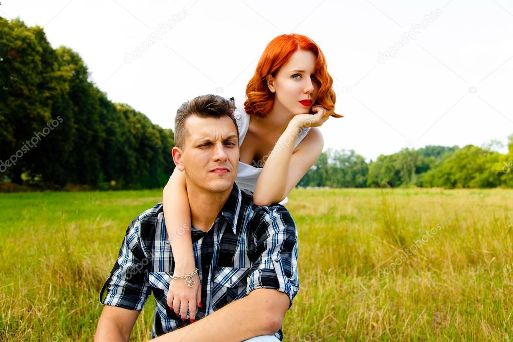 Redheaded woman with man