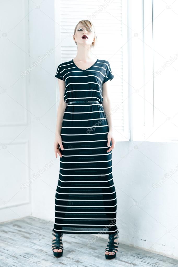 Woman in a black striped dress