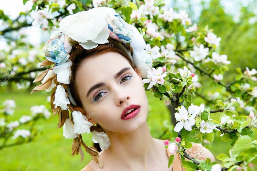 Sensual woman in floral wreath