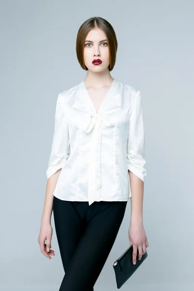 Beautiful woman in white blouse — Stok fotoğraf
