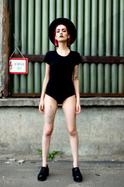 Attractive young woman in rounded hat