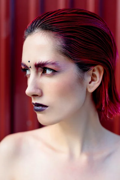 Attractive young woman with colorful makeup — ストック写真