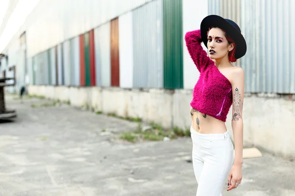 Attractive woman in black rounded hat — Stock Photo, Image