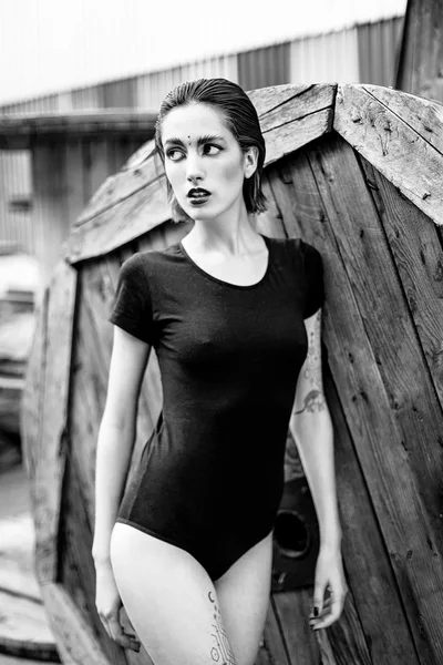 Attractive young woman in black bodywear — Stock Fotó