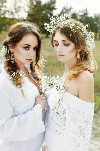 Two women in white dresses — Stock Photo, Image