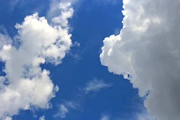 bizarre clouds in the blue summer sky