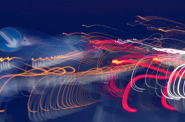 Abstract light trails captured from cars, signs, and other landmarks. — Stock Photo, Image