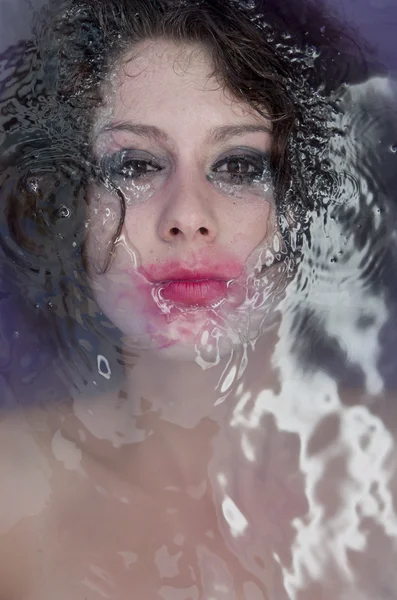Drowning victim Woman with full make up floating in the water.