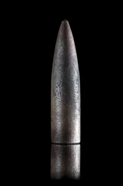The bullet from  second world war found using a metal detector to on black background, England. — Stock Photo, Image
