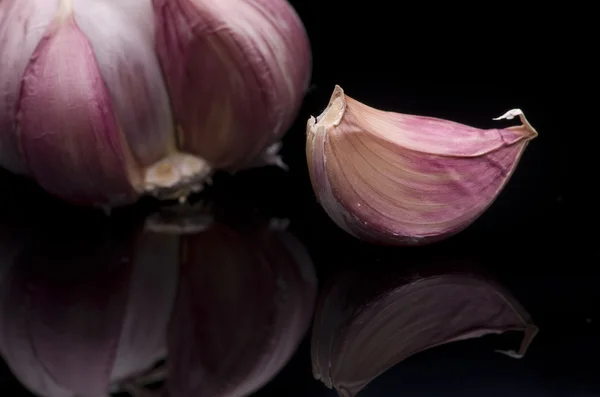 Garlic isolated on black background — Stock Photo, Image