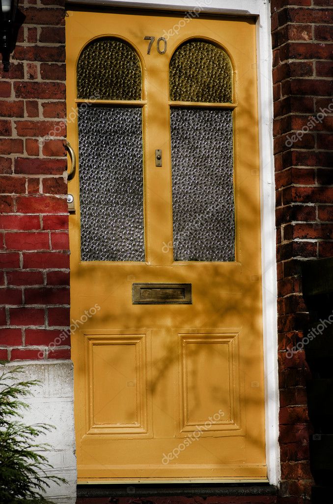Yellow Front Door Of A Red Brick English Town House Manchester