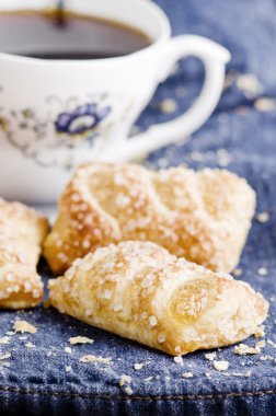 Delicious freshly baked pie on blue jeans.