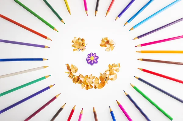 Smiling sun arranged from crayons and pencil sharpening. — Stok fotoğraf