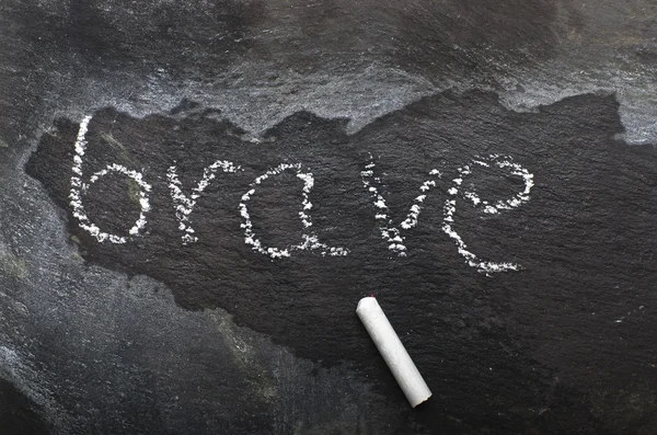 The word BRAVE written with chalk on black stone. — Stock Photo, Image