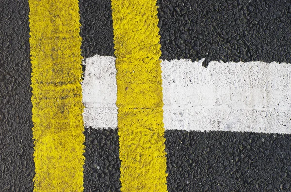 Traffic lines on the asphalt road surface is composed of one type of background. — Stock Photo, Image