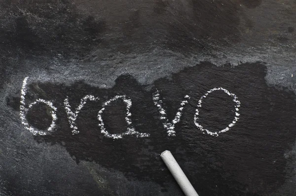 The word BRAVO written with chalk on black stone. — Stock Photo, Image