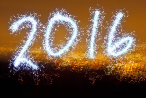 Yıl 2016 parlak arka plan üzerinde yazılı. — Stok fotoğraf