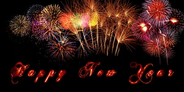 Parole Felice Anno Nuovo scritte su banner con fuochi d'artificio scintillanti e lettere brucianti su sfondo nero . — Foto Stock